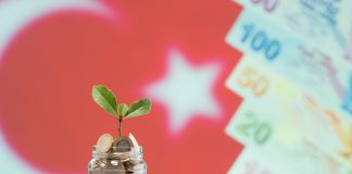 Turkish coin in Jar with the turkey flag in the background