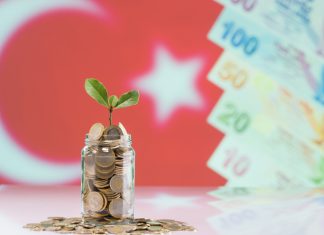 Turkish coin in Jar with the turkey flag in the background