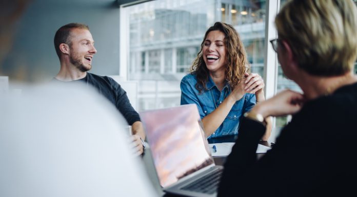 What Does Psychological Safety Look Like at Work? Employees having fun during a meeting