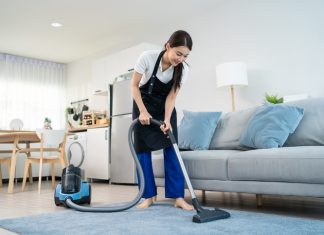 Woman cleaning the carpet