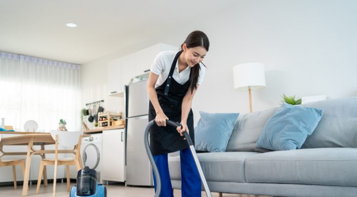 Expert Tips for Effective Carpet Cleaning at Home Woman cleaning the carpet