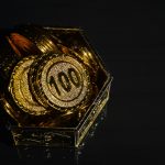 Bunch of coins in plastic cup isolated on a white background