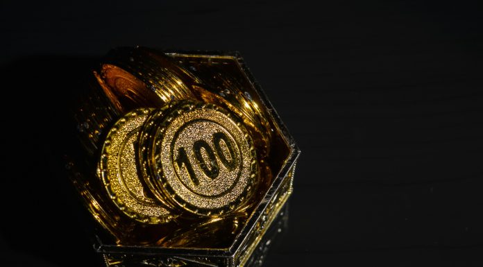 The Importance of Supportive Customer Service in Online Casinos in Malaysia Bunch of coins in plastic cup isolated on a white background