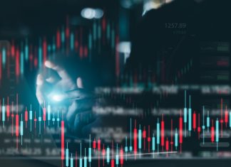Businessman working in office, technical price chart and red and green candlestick chart indicator and computer screen background for stock trading, double exposure Traders analyze data.