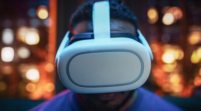 Exploring the Vast World of Console Gaming Cinematic Portrait of a Young Stylish Black Man Using Virtual Reality Headset with Joysticks