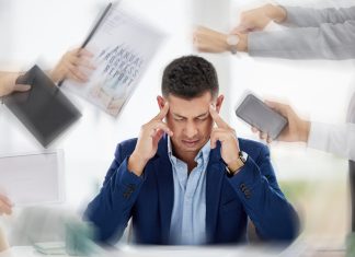 Managing Workplace Stress Before it Becomes Critical Businessman experiencing stress and anxiety