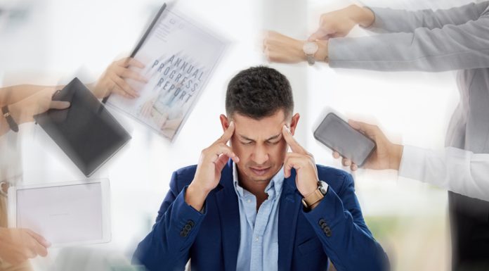 Managing Workplace Stress Before it Becomes Critical Businessman experiencing stress and anxiety