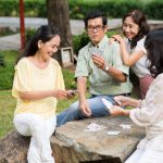 People playing cards outdoor