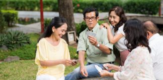 People playing cards outdoor