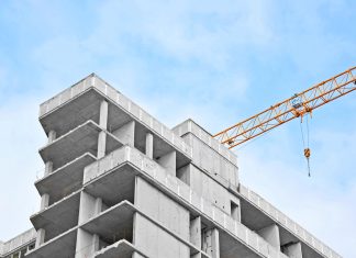 Crane and highrise construction site