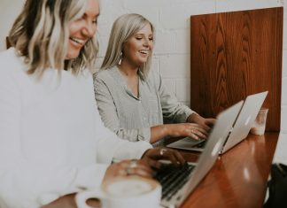 AI in Action: 3 Ways It Transforms L&D Teams for Success two women using laptops