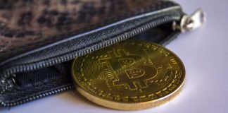 Bitcoin in leather wallet