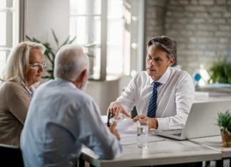 Adult couple having a meeting with their accountant
