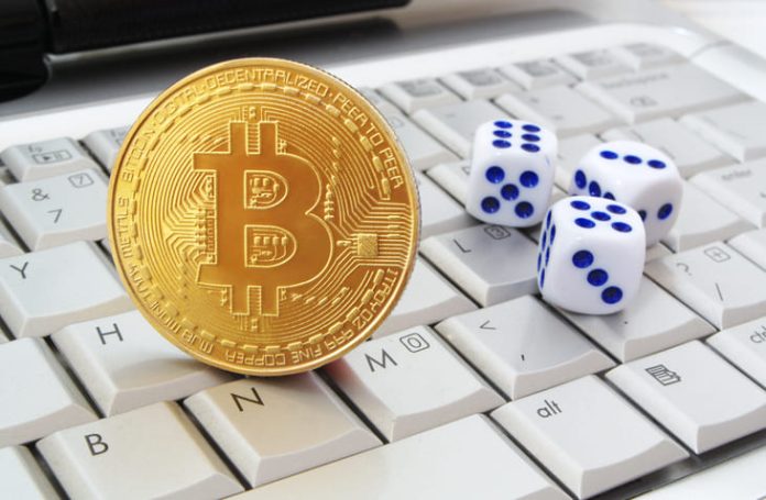 iStock-1253861947 (1) Bitcoin and casino dice on keyboard