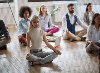 Workplace Mindfulness: Unforeseen Effects for Companies Employees meditating at the workplace
