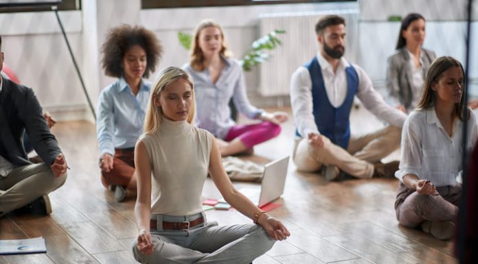 Workplace Mindfulness: Unforeseen Effects for Companies  Employees meditating at the workplace