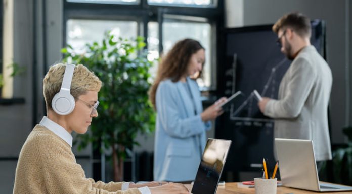 Woman wearing headset while working