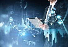 The Power of Financial Data APIs in Modern Finance Businessman holding tablet for stocks