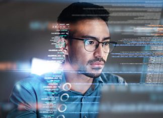 Man using computer with website info