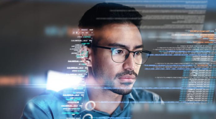 Man using computer with website info