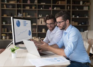 Unlocking Productivity: How Empowering Employees with Accounting Access Transforms Business Efficiency Employees collaborating on financial marketing reports