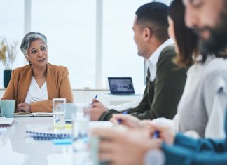 Pioneering the Future of Insurance: A Journey in Teamwork, Leadership and Innovation CEO in a meeting with the team members