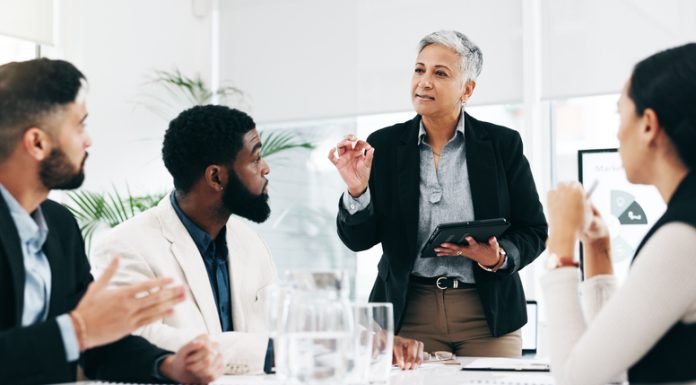 Business woman sharing idea and strategy with the members