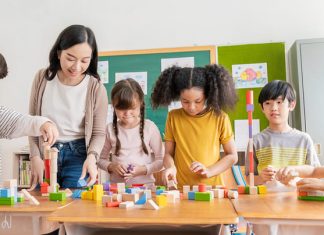 Students playing at school together with their teacher