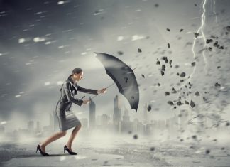 A Beacon of Leadership: Pioneering Resilience for Vulnerable Communities through Insurance Woman with umbrella against disaster