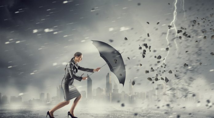 Woman with umbrella against disaster