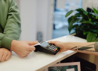 A Person Holding a Bank Card