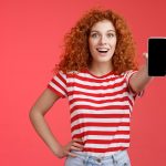 How to Use Pin Up Casino App to Play to Go Woman showing her phone