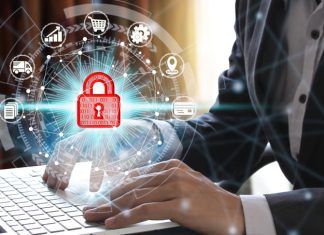 Businessman using computer with security