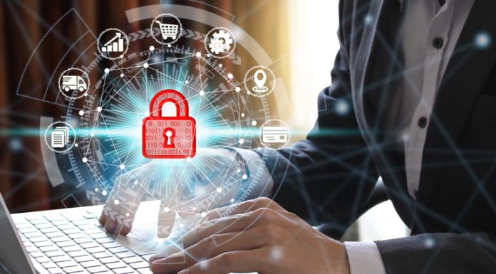 Businessman using computer with security