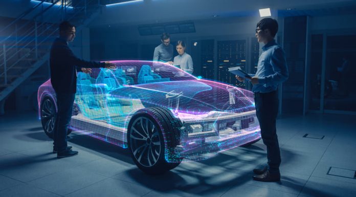 Engineers Working on Augmented Reality 3D Model Electric Car