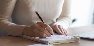 Female student writing notes