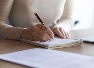 Female student writing notes