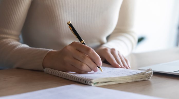 Female student writing notes