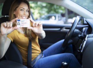 Driver’s License As A Status Symbol: Is It Still Relevant For Canadian Millennials? Female holding a driver license