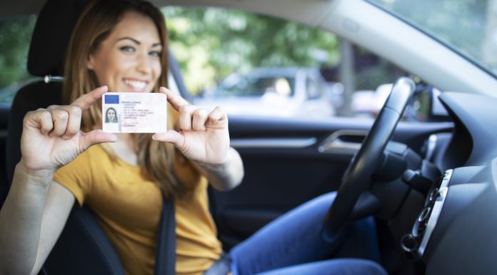 Female holding a driver license