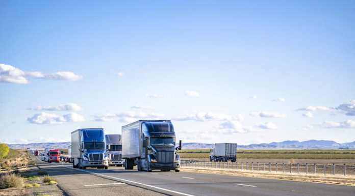 Semi trailers running on the divided highway road