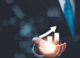 Businessman showing business growth and success graph