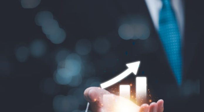 Businessman showing business growth and success graph