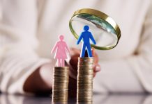 Shaping a More Inclusive Future for Finance: The Rise of Gender Lens Investing Coin stacks with gender symbol and magnifying glass
