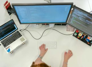 Female Software Engineer Coding on Computer