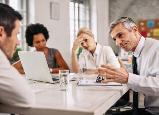 Why We Need to Learn to Disagree Well in the Workplace? Angry businessman discussing with colleague