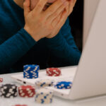 Ride the Emotional Waves: Master Your Feelings in Online Gambling Man playing with his computer on gambling websites