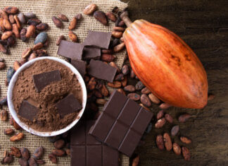 Cocoa powder on raw cocoa beans