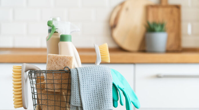 Modern kitchen interior in the background. House cleaning concept.