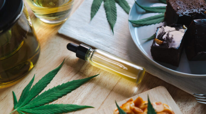 Food and drink and cannabis oil on the dining table. Alternative medicine concept.